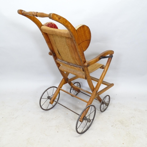 2622 - A mid-century mahogany folding pushchair, 60cm x 90cm x 48cm