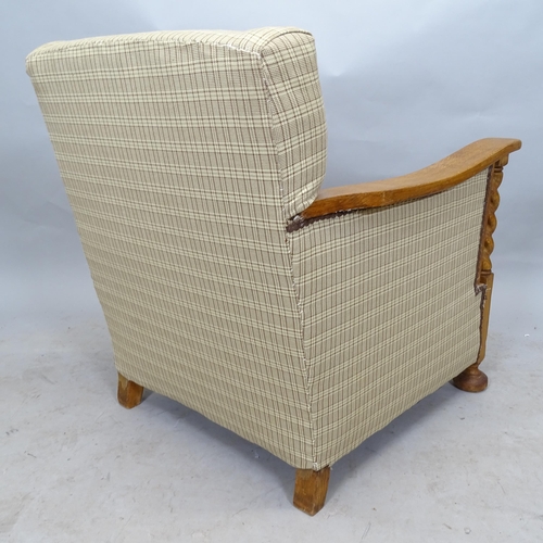 2632 - A 1920s oak and upholstered armchair, with barley twist decoration