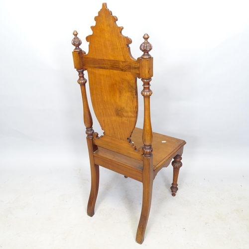 2664 - A 19th century mahogany hall chair, with applied carved decoration