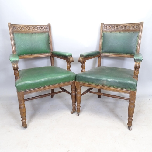 2666 - A pair of 1930s oak and green faux leather upholstered armchairs