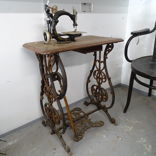 2667 - A Vintage Industrial treadle sewing machine, with label for Wilcox & Gibbs of New York, base 62cm x ... 