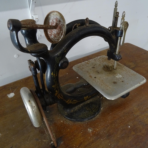 2667 - A Vintage Industrial treadle sewing machine, with label for Wilcox & Gibbs of New York, base 62cm x ... 