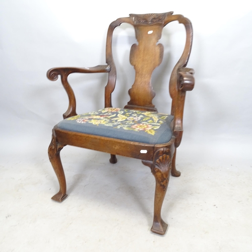 2673 - An Antique mahogany and upholstered open armchair, on cabriole legs with carved shell decoration