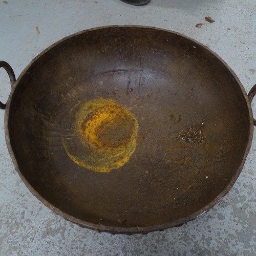 2731 - An Indian cast-iron Kadai, width 63cm
2731-2733 sold together