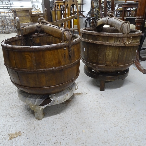 2738 - A pair of Chinese elm and steel-bound dome-bottom buckets on stands, W50cm, H55cm