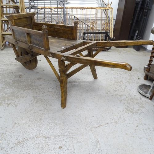 2739 - A Chinese elm wheelbarrow, height 70cm, length 170cm