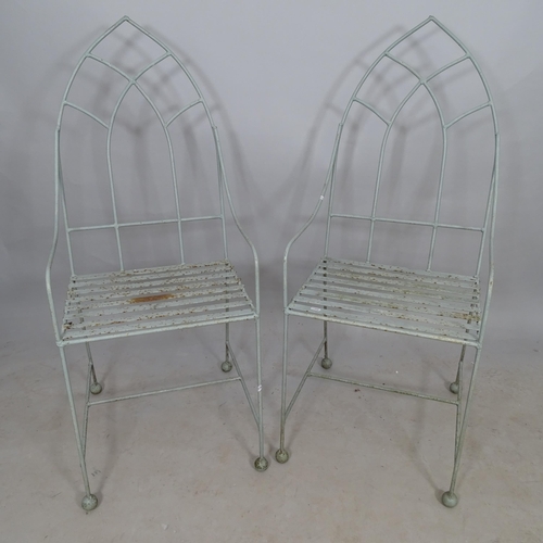 2748 - A pair of Gothic design wrought-iron garden armchairs