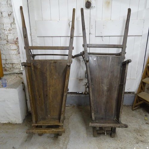 2761 - A pair of Chinese elm wheelbarrows, length 156cm