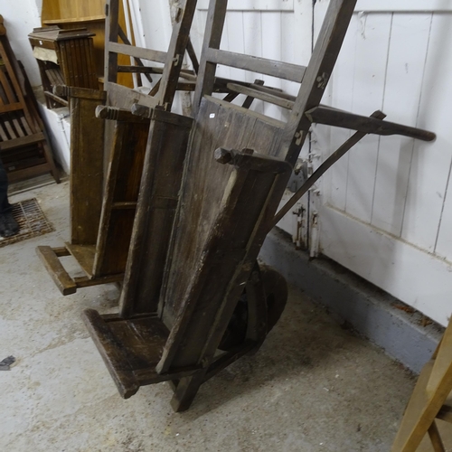 2761 - A pair of Chinese elm wheelbarrows, length 156cm