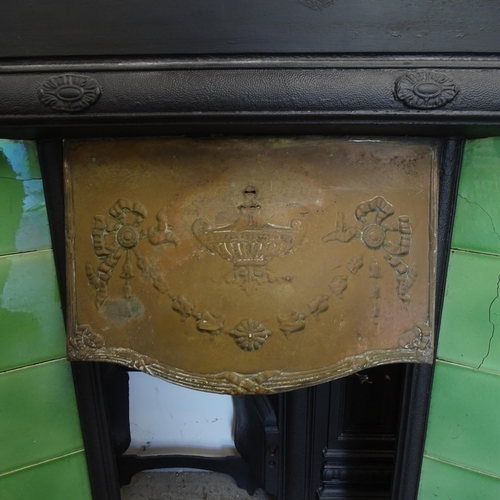 2778 - An Antique cast-iron fire surround, with tiled panels and brass hood, 91cm x 97cm