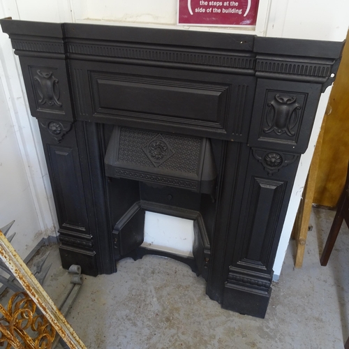 2779 - A painted wrought-iron fire surround, 99cm x 107cm