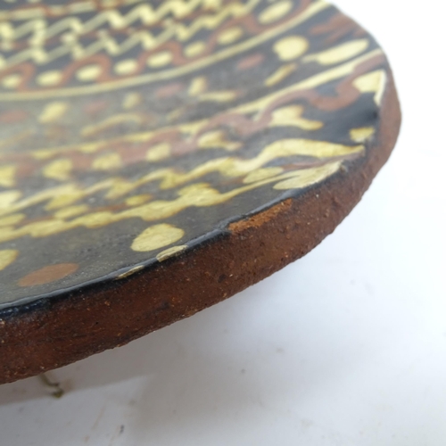 163 - An earthenware pottery slipware shallow dish, length 37cm
