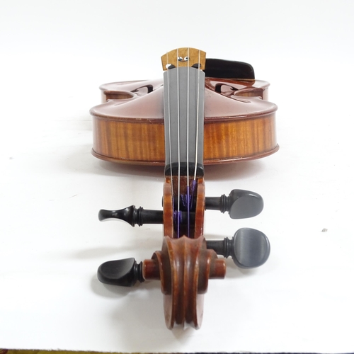 238 - A modern violin in a modern velvet-lined case, bow is not included