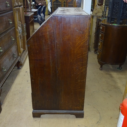 2182 - A Georgian oak bureau, with well fitted interior, and 2 short and 2 long drawers, on bracket feet, 9... 