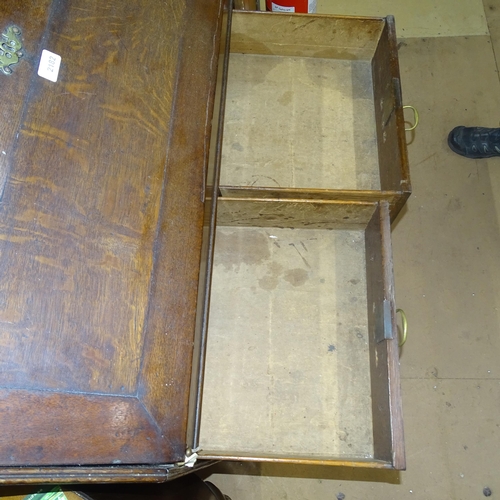 2182 - A Georgian oak bureau, with well fitted interior, and 2 short and 2 long drawers, on bracket feet, 9... 