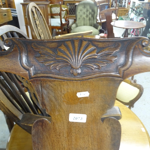 2673 - An Antique mahogany and upholstered open armchair, on cabriole legs with carved shell decoration