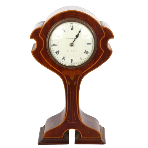 1001 - An Edwardian Art Nouveau mahogany-cased mantel clock of highly stylised form, with inlaid floral mot... 