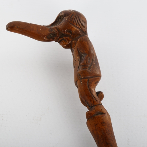 1007 - A 19th century novelty walking stick, the handle carved in the form of a one-legged man with a big n... 