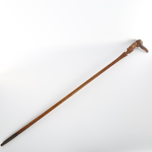 1007 - A 19th century novelty walking stick, the handle carved in the form of a one-legged man with a big n... 