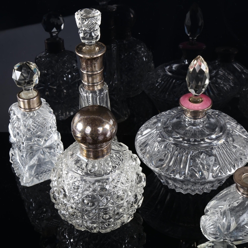 1035 - A group of 9 silver-mounted perfume bottles, including 1 with a pink enamel collar, tallest 17cm (9)