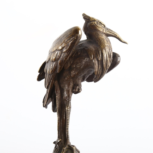 1036 - A 19th century patinated bronze sculpture of a heron, unsigned, on black slate socle base, height 20... 