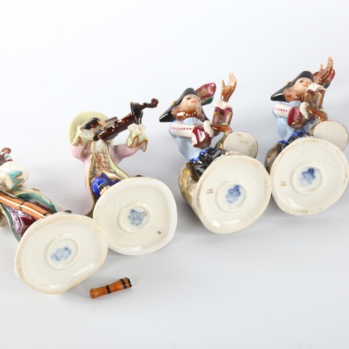 1040 - A collection of early 20th century German Volkstedt porcelain monkey band figures, largest height 15... 