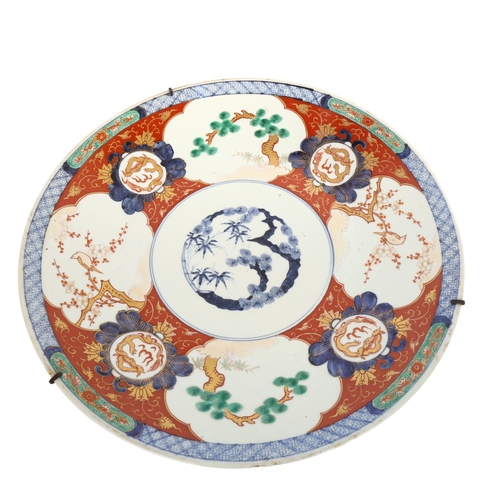 1049 - A large Japanese 19th century porcelain charger with painted and gilded decoration, 4 character mark... 