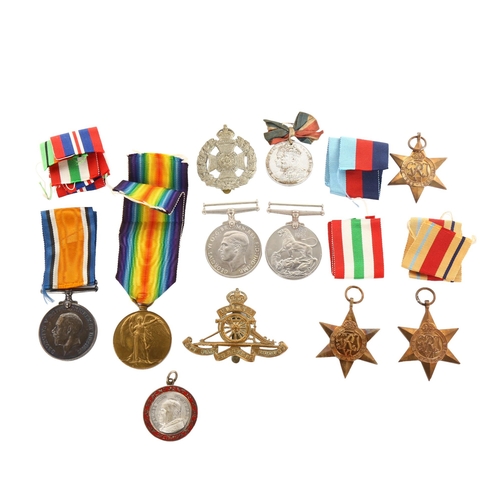 1055 - A collection of Great War and Second World War General Service medals, cap badges and medallions, Fi... 