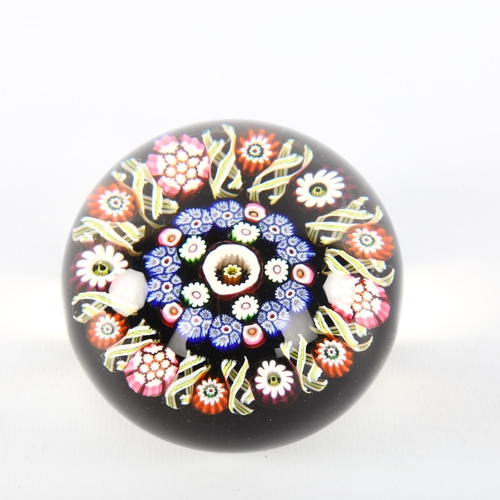 1065 - A Millefiori glass paperweight, diameter 7cm, height 5.5cm