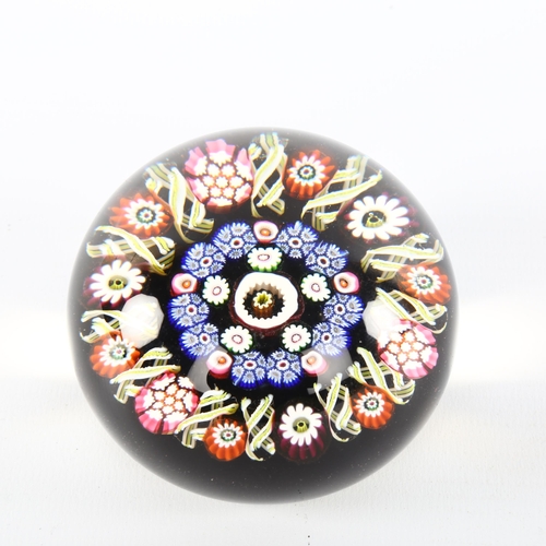 1065 - A Millefiori glass paperweight, diameter 7cm, height 5.5cm