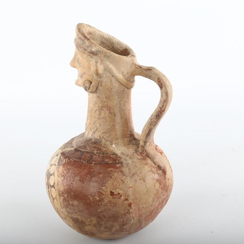 1091 - Indus Valley Ancient terracotta mask-headed jug, circa 2nd/3rd century BC, height 21cm