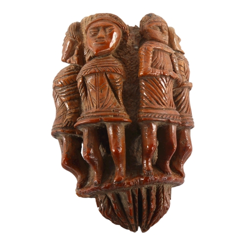 1092 - An 19th century nut flask with relief carved figures all round, length 6.5cm