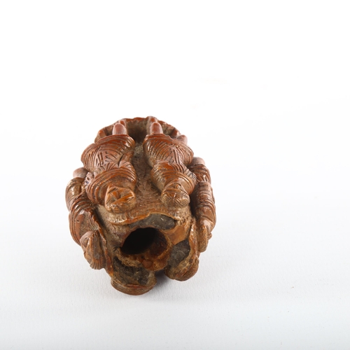 1092 - An 19th century nut flask with relief carved figures all round, length 6.5cm