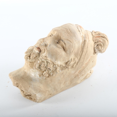 1096 - A Mesopotamian terracotta head of a man, height 18.5cm