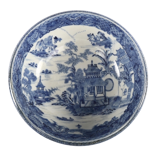 1099 - An 18th century blue and white transfer decorated bowl, diameter 27cm, restored