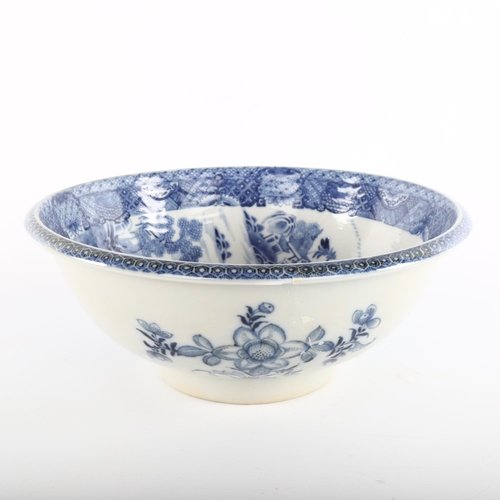 1099 - An 18th century blue and white transfer decorated bowl, diameter 27cm, restored