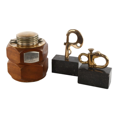 1101 - A brass and mahogany tobacco jar in the form of nuts and bolts, plaque dated 1953 Portsmouth, height... 