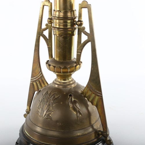 1010 - Victorian brass and blue glass duplex oil lamp, in the manner of Christopher Dresser, with embossed ... 