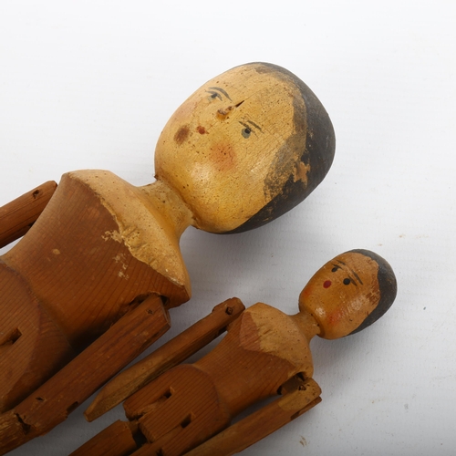 1117 - 2 Victorian painted and jointed wood peg dolls, largest height 28cm (2)