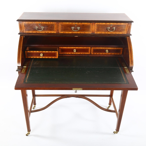 1073 - An Edwardian mahogany cylinder-front writing desk, with inlaid marquetry and banding on shaped stret... 