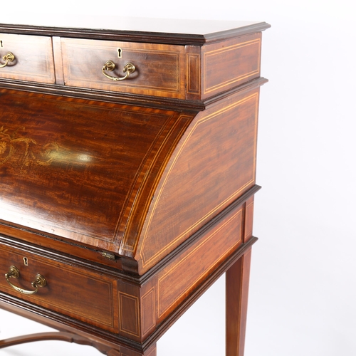 1073 - An Edwardian mahogany cylinder-front writing desk, with inlaid marquetry and banding on shaped stret... 