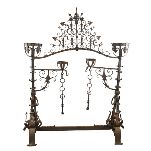 1075 - An exceptional late 17th century wrought-iron andiron for an inglenook fireplace, the joined pair to... 