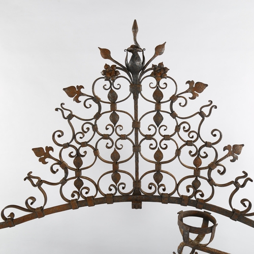 1075 - An exceptional late 17th century wrought-iron andiron for an inglenook fireplace, the joined pair to... 