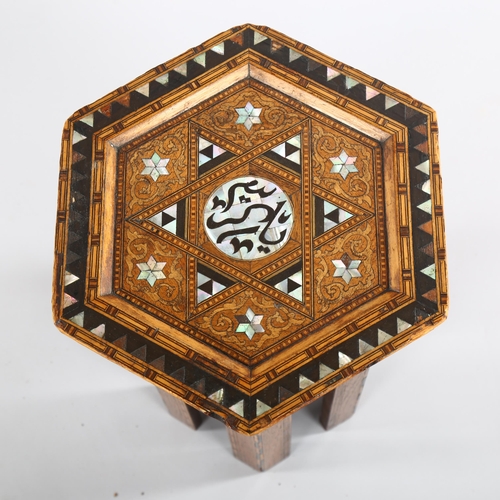 1080 - A small Anglo-Moorish hexagonal occasional table in the manner of Liberty & Co, with inlaid mother-o... 