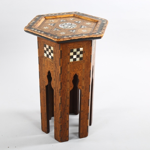 1080 - A small Anglo-Moorish hexagonal occasional table in the manner of Liberty & Co, with inlaid mother-o... 