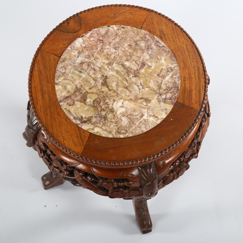 1082 - A Chinese rosewood circular occasional table, with inset marble top and carved frieze, diameter 31cm... 