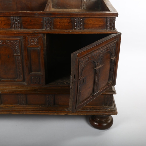 1121 - 18th century Italian walnut blanket chest, with Arcadian carved and panelled cupboards below and ris... 