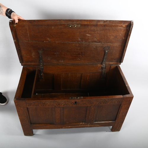 1123 - A small 18th century oak blanket chest with panelled front, length 98cm