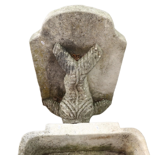 1125 - A weathered reconstituted stone gurgle fish design wall fountain and basin, basin width 72cm