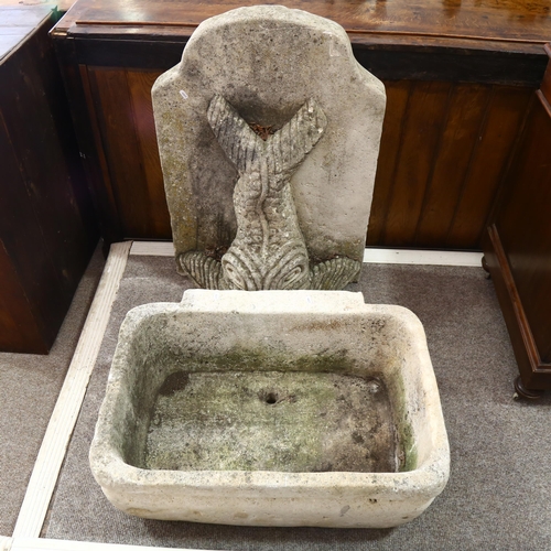 1125 - A weathered reconstituted stone gurgle fish design wall fountain and basin, basin width 72cm